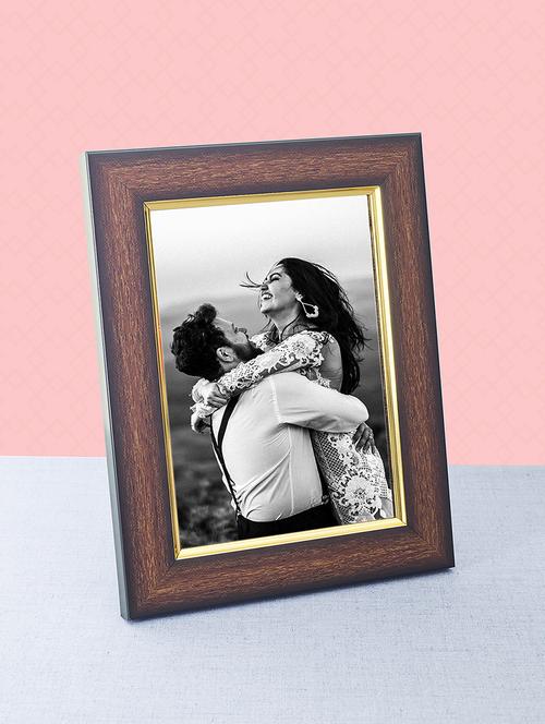 wooden brown golden border table photo frame - 17335642 - Standard Image - 1