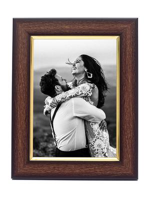 wooden brown golden border table photo frame - 17335642 - Standard Image - 2