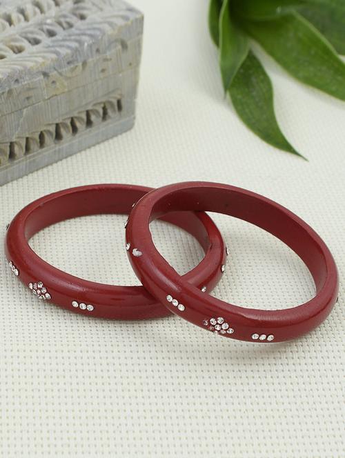 red brass bangles - 17431958 - Standard Image - 1
