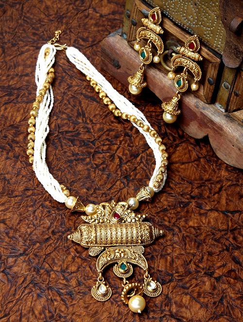 gold metal necklaces and earring - 17534184 - Standard Image - 1