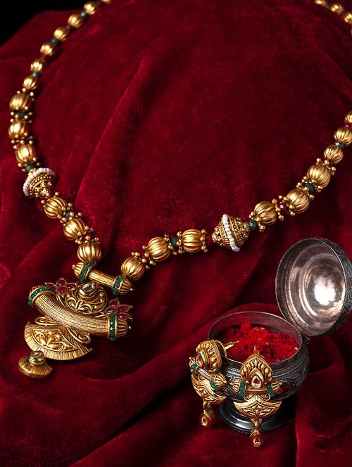 gold metal necklaces and earring - 17534199 - Standard Image - 1