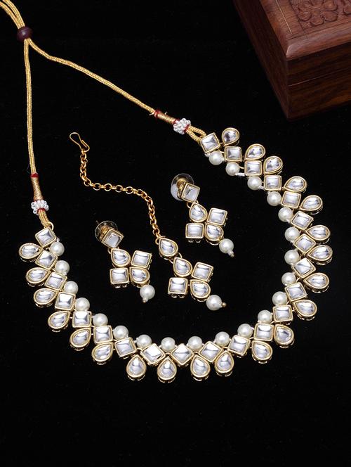 gold metal necklaces and earring - 17534212 - Standard Image - 1